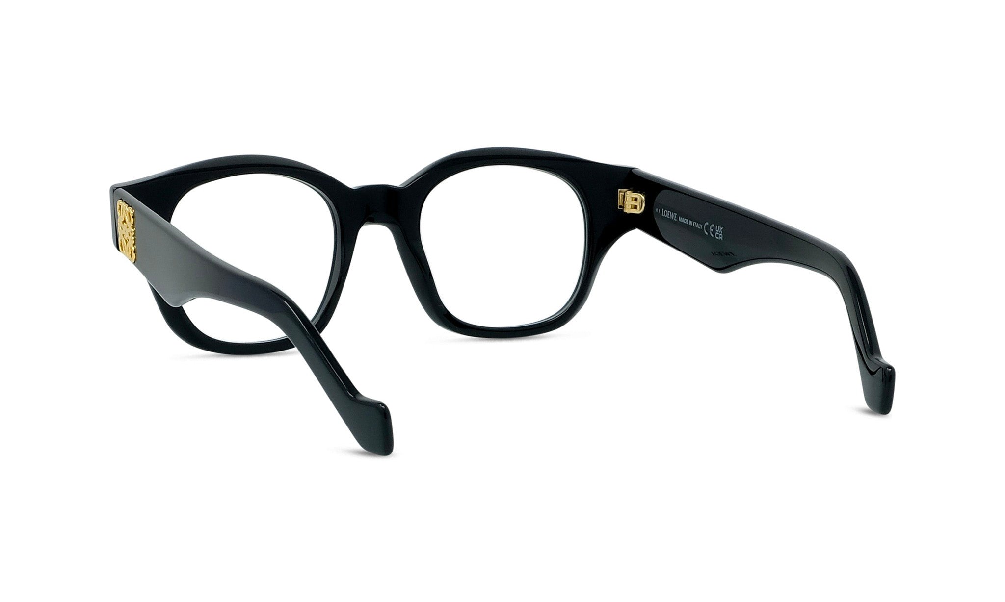 A pair of black-framed glasses with gold accents.