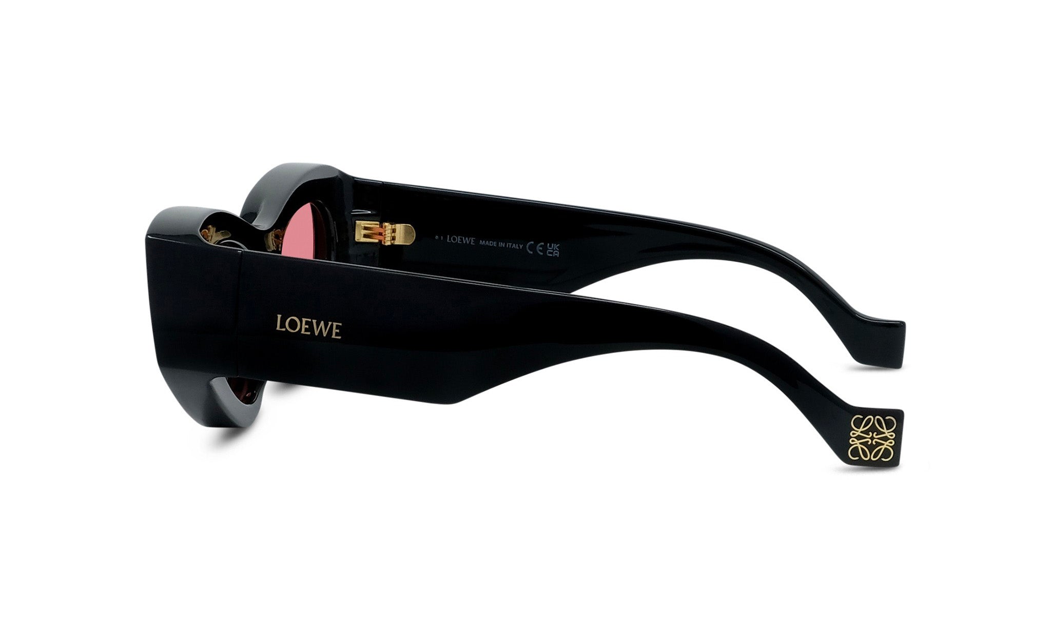 A pair of black sunglasses with gold accents and the LOEWE brand name visible.