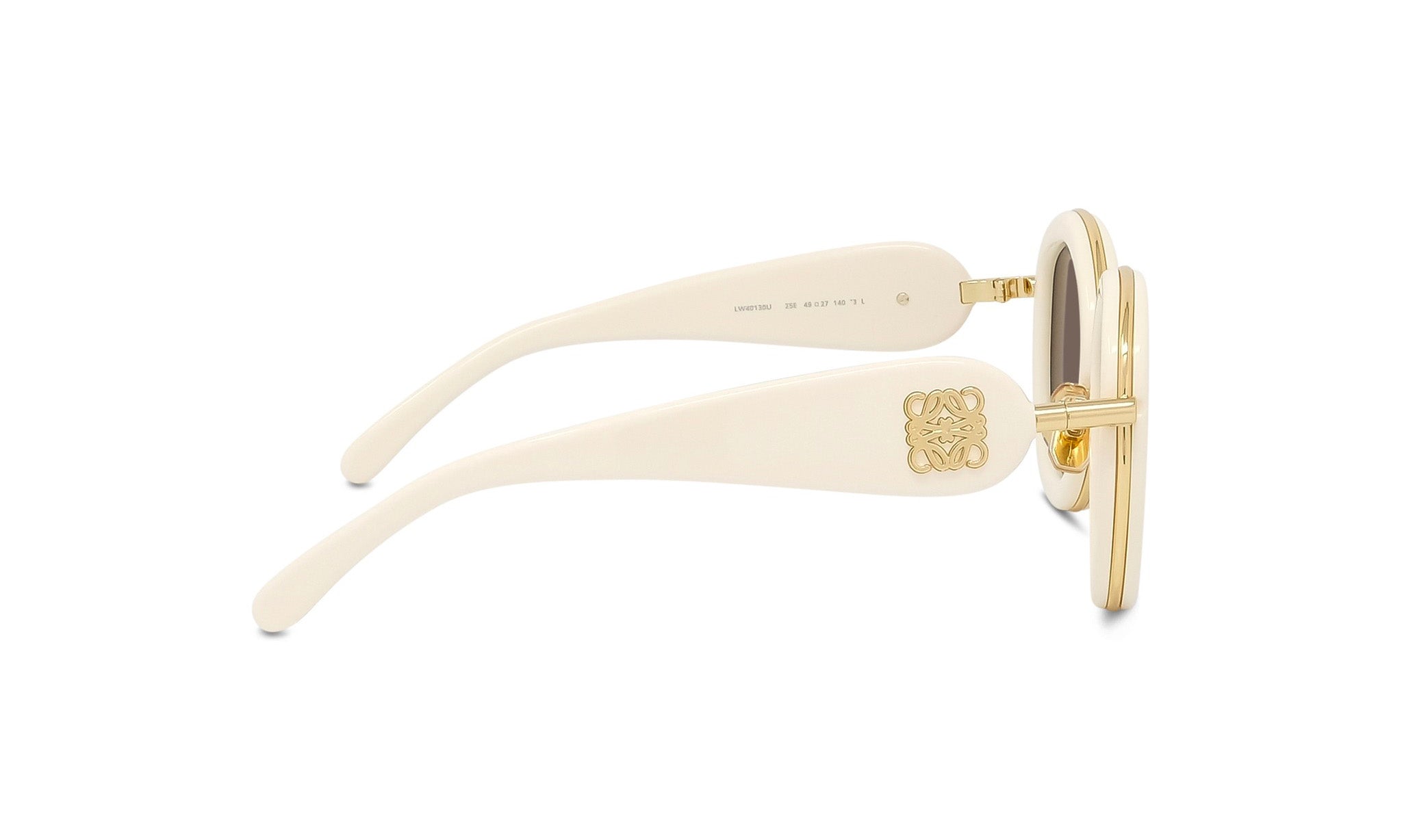 A pair of white, gold, and black sunglasses with a gold emblem on the frame.