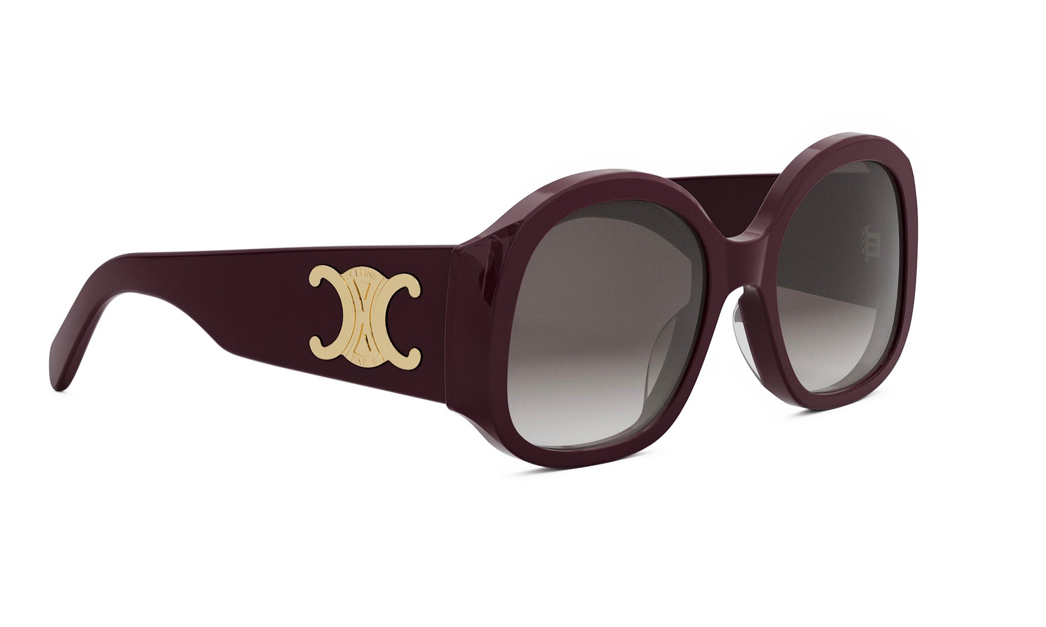 A pair of burgundy-colored sunglasses with a gold-colored logo on the side.