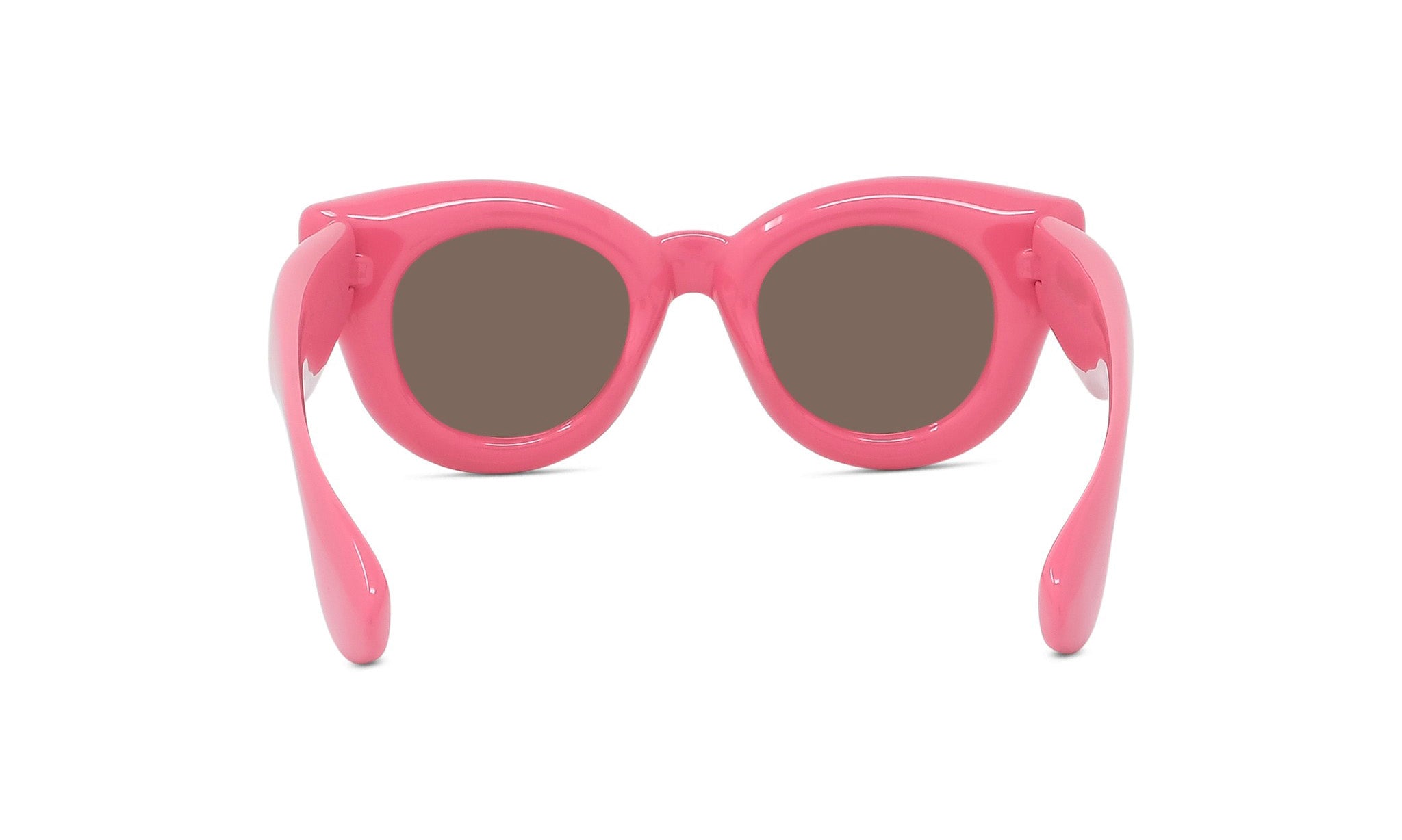 A pair of pink sunglasses with brown lenses.