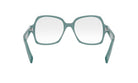 A pair of green-framed glasses with a white lens, shown from the front view.