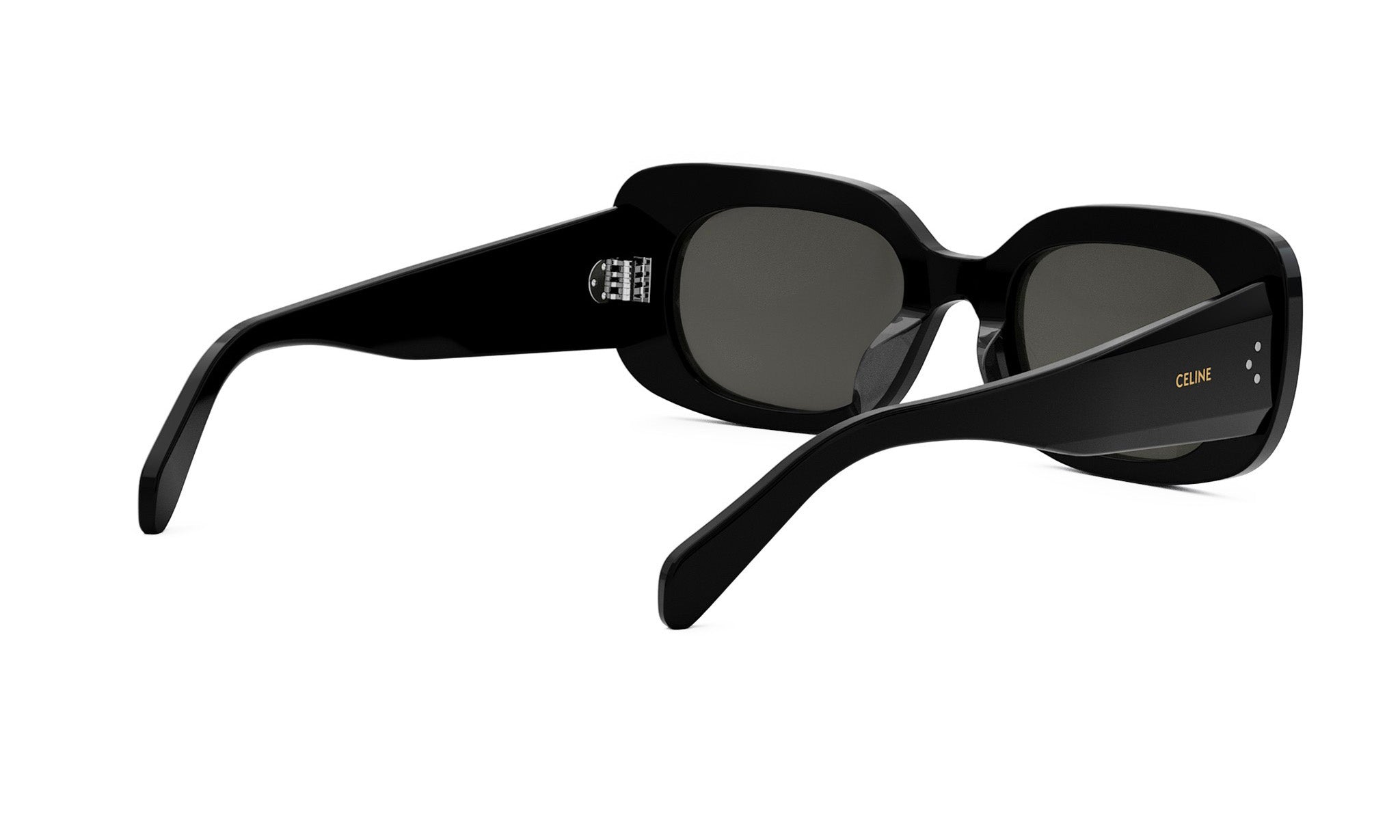 A pair of black sunglasses with a Celine logo on the frame.