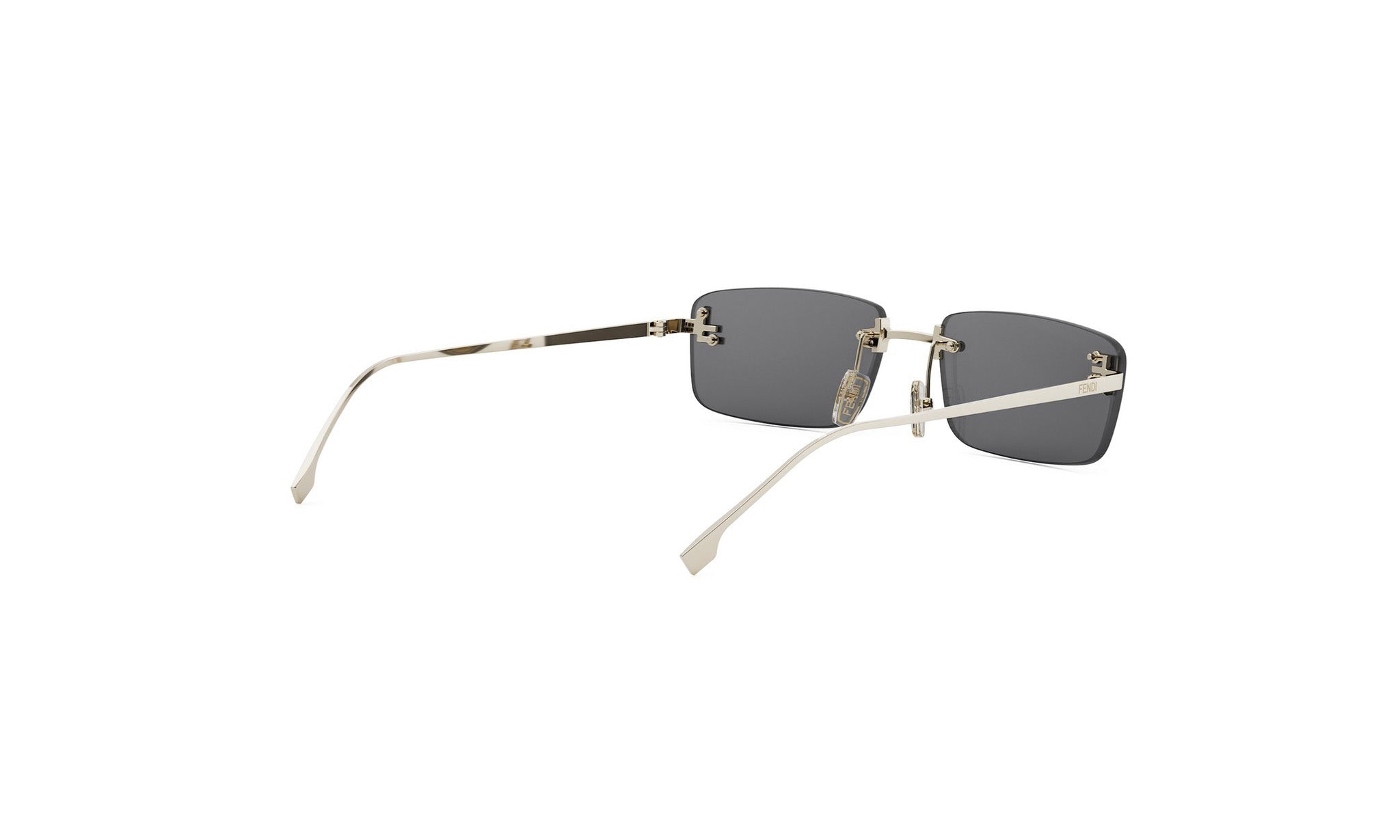 A pair of dark-tinted rectangular sunglasses with a silver frame and white accents.