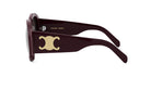 A pair of burgundy-colored sunglasses with a gold Celine Paris logo on the frame.