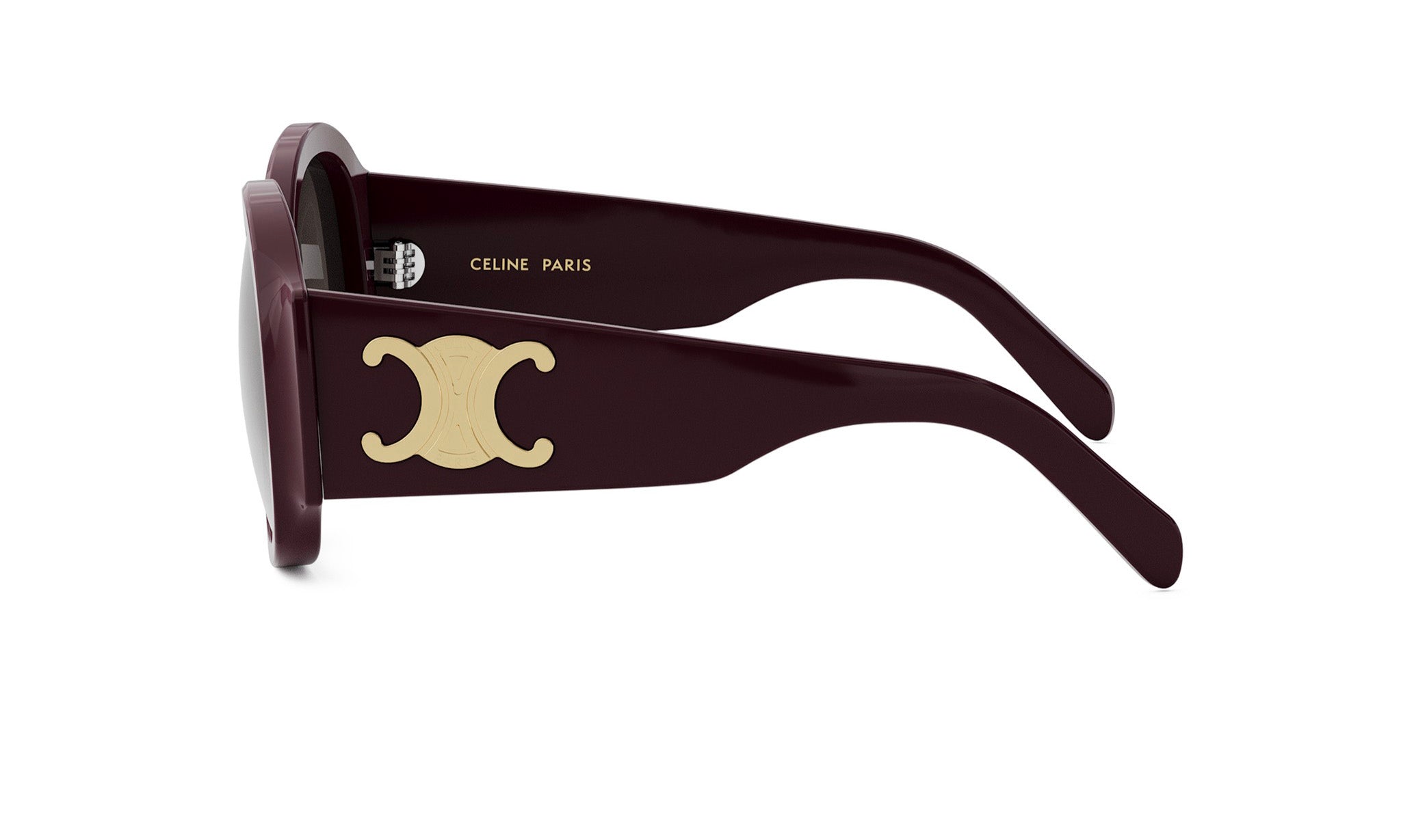 A pair of burgundy-colored sunglasses with a gold Celine Paris logo on the frame.