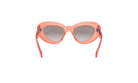 A pair of pink cat-eye sunglasses with a dark lens.