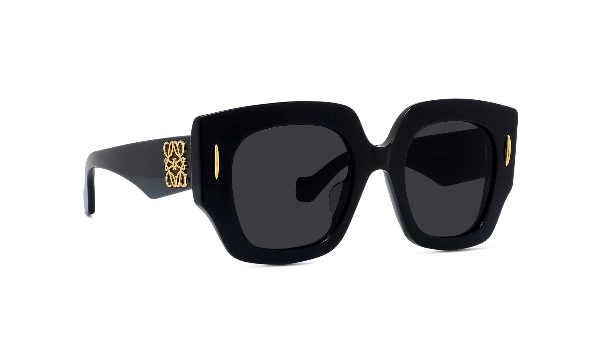 A pair of black sunglasses with gold accents, featuring a square frame and dark lenses.