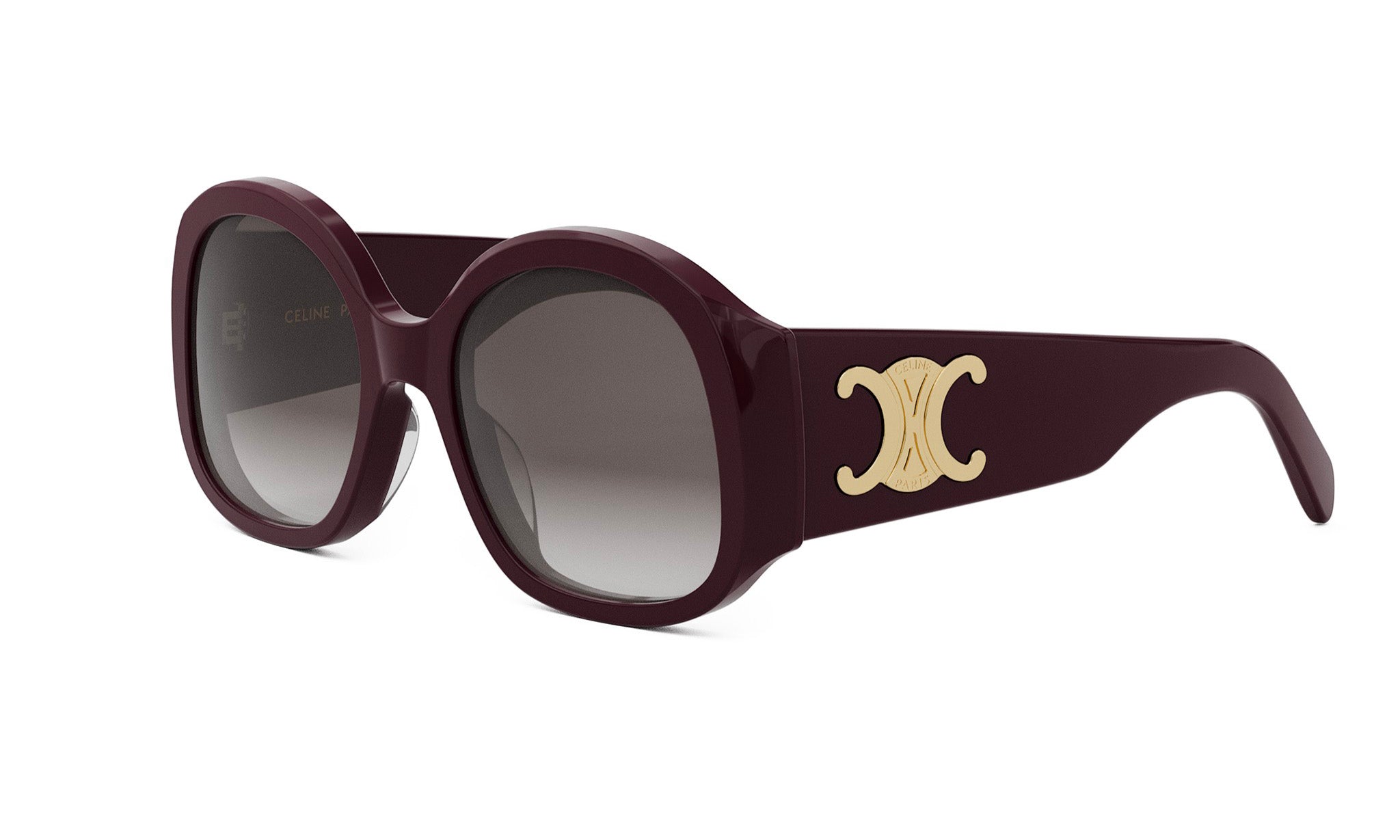 A pair of burgundy-colored sunglasses with a gold C logo on the frame.