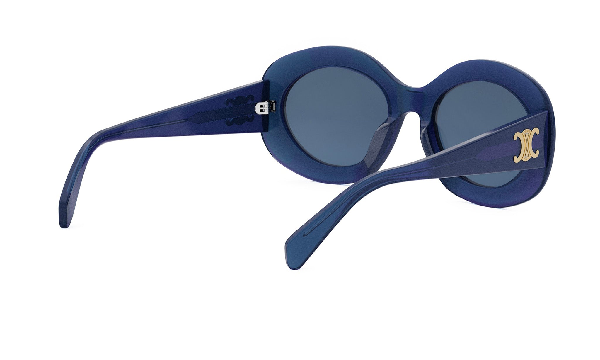 A pair of blue sunglasses with a gold logo on the frame.