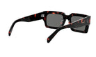 A pair of sunglasses with a tortoiseshell frame and dark lenses.