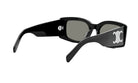 A pair of black sunglasses with a white logo on the frame.
