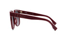 A pair of burgundy-colored Fendi sunglasses with the brand name prominently displayed on the frame.
