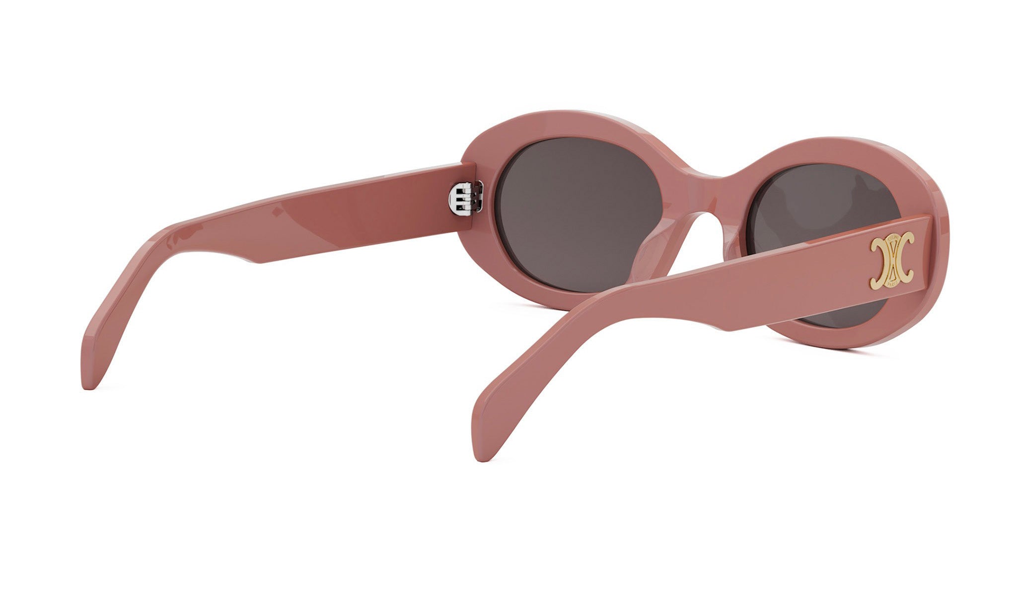 A pair of pink sunglasses with a gold C logo on the frame.