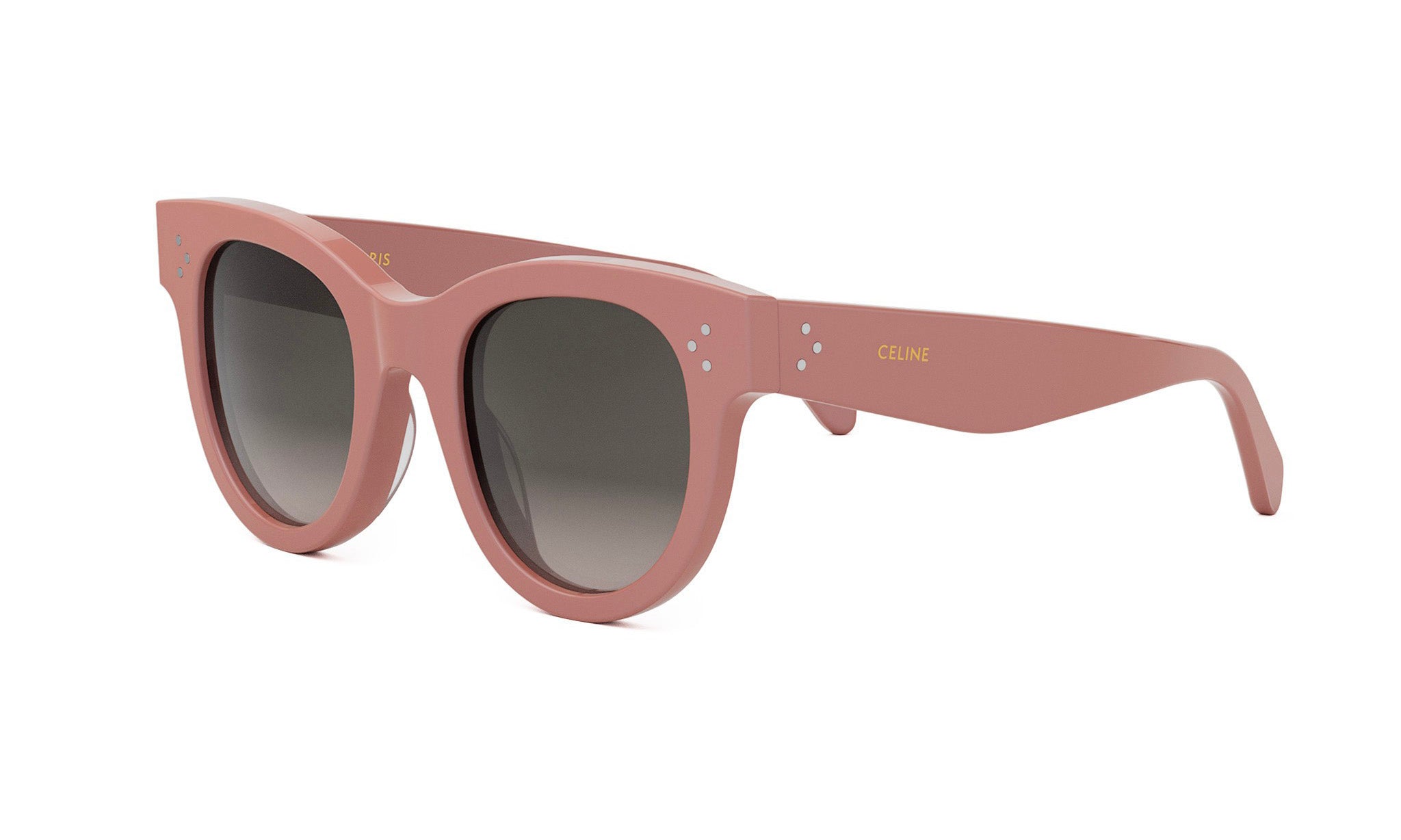 A pair of pink sunglasses with a Celine brand logo on the frame.