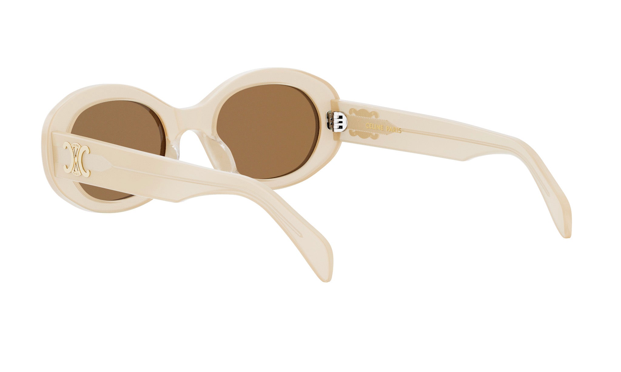 A pair of cream-colored sunglasses with a gold-colored frame and a gold-colored logo on the temple.