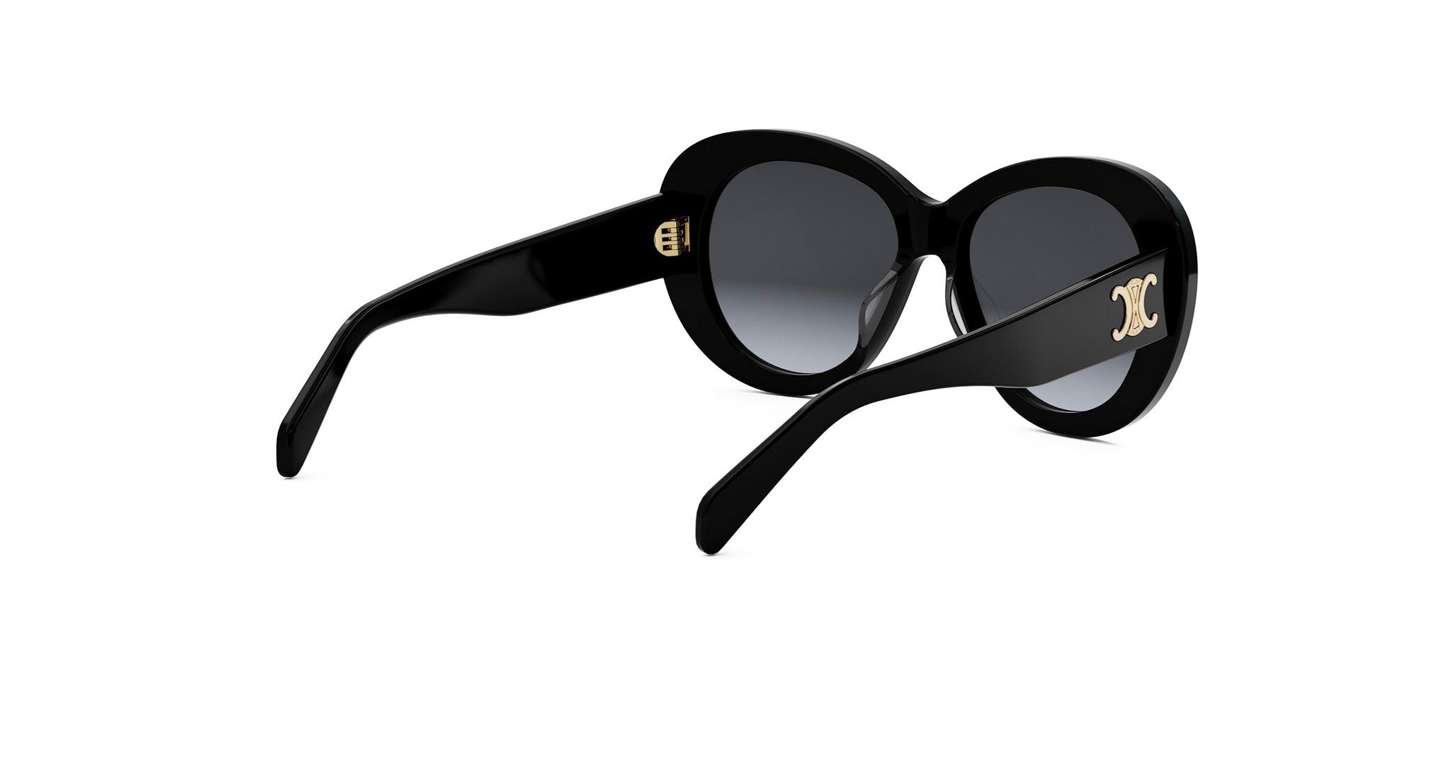 A pair of black sunglasses with gold accents, featuring a large "C" logo on the frame.