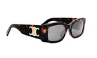 A pair of stylish sunglasses with a tortoiseshell frame and a white logo on the side.
