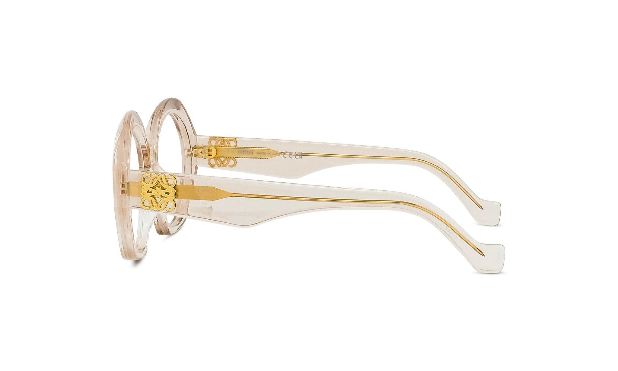 A pair of stylish, gold-colored eyeglasses with a clear frame and gold-colored accents.