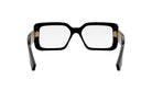 A pair of black-framed glasses with gold accents, positioned facing forward against a white background.