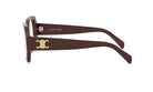 A pair of brown-framed sunglasses with a gold logo on the side.