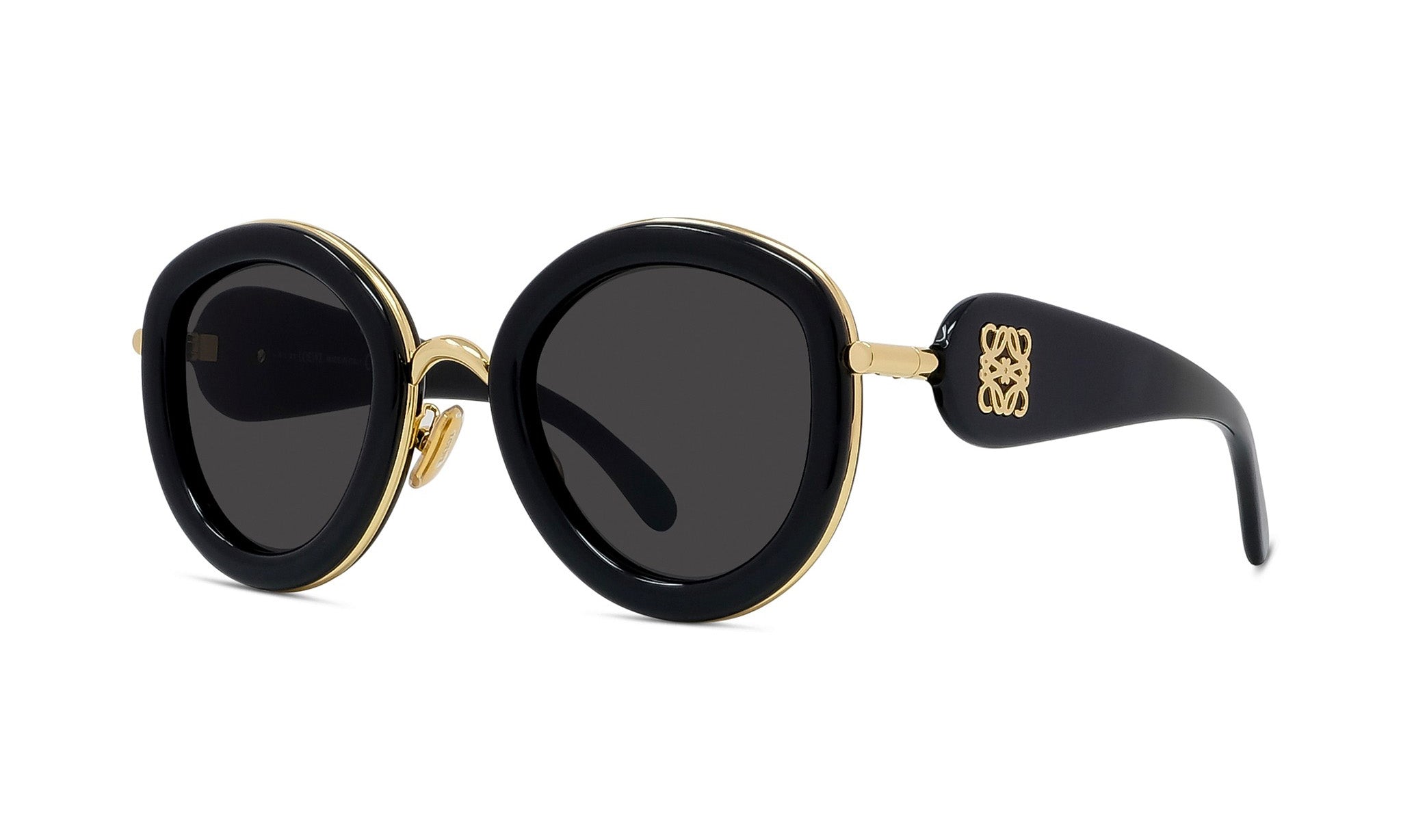 A pair of stylish black sunglasses with gold accents, featuring a round frame and dark lenses.
