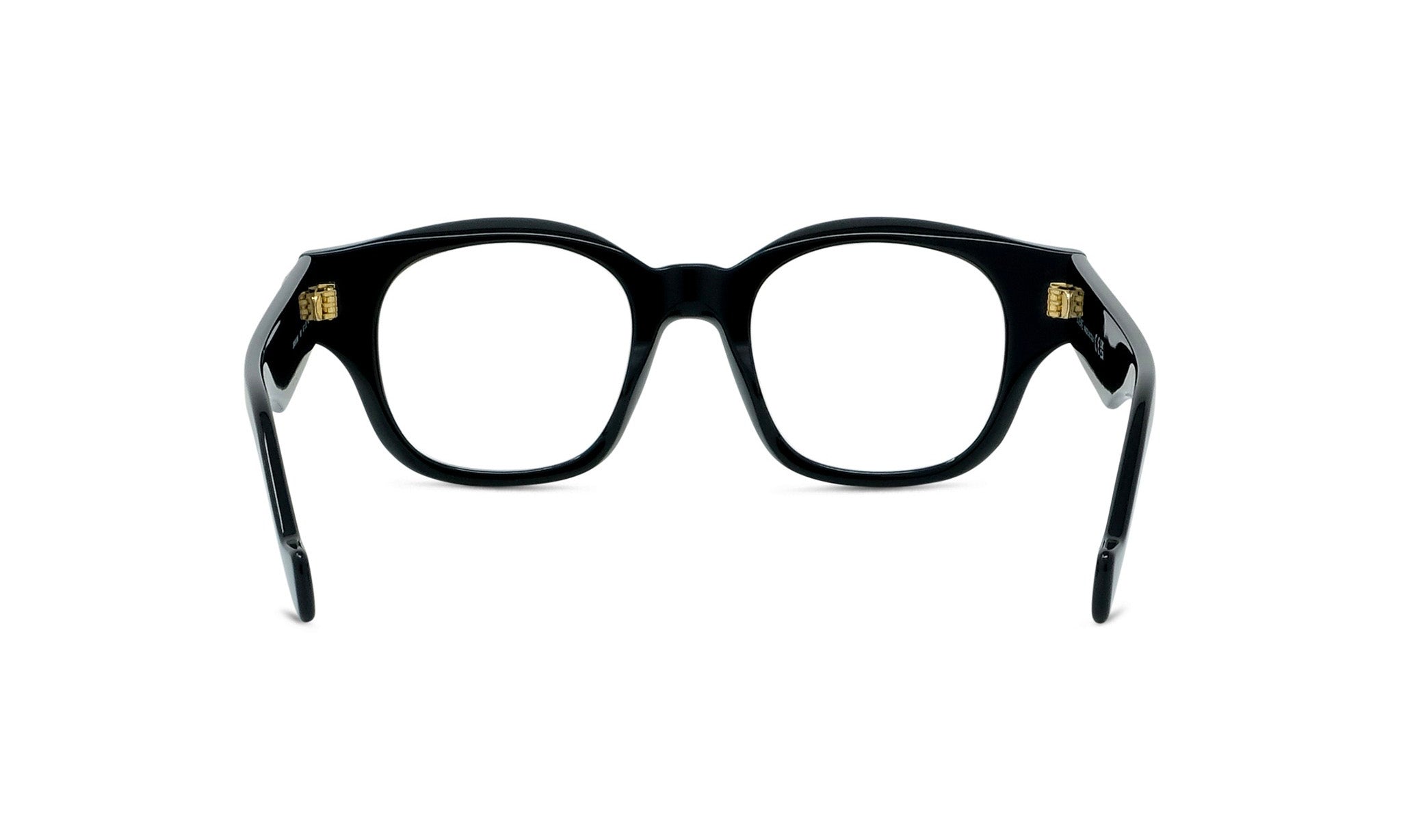 A pair of black-framed glasses with gold-colored temples.