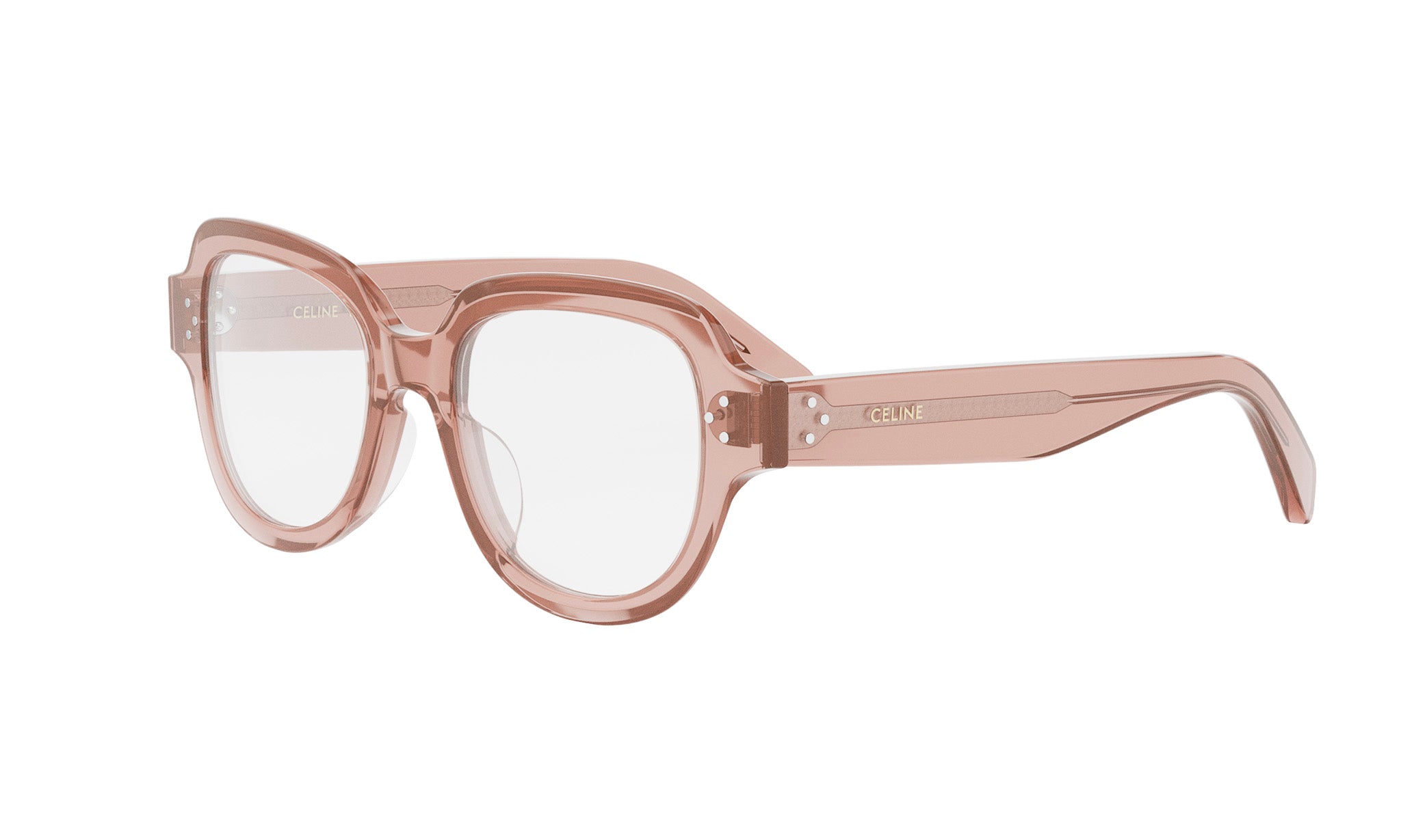A pair of peach-colored, oversized, and oversized-framed glasses with the Celine logo visible on the temples.