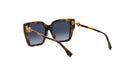 A pair of sunglasses with dark tortoiseshell frames and dark blue lenses.