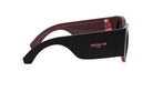 A pair of black sunglasses with a red frame and the logo of Christian Dior on the side.