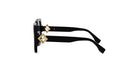 A pair of black sunglasses with gold accents, featuring a diamond-shaped logo on the temples.