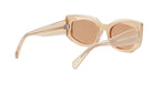 A pair of tan-colored sunglasses with a clear frame and dark lenses.