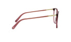 A pair of red-tinted eyeglasses with gold-colored arms and temples.