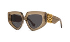 A pair of stylish sunglasses with a gold-colored frame and dark lenses.
