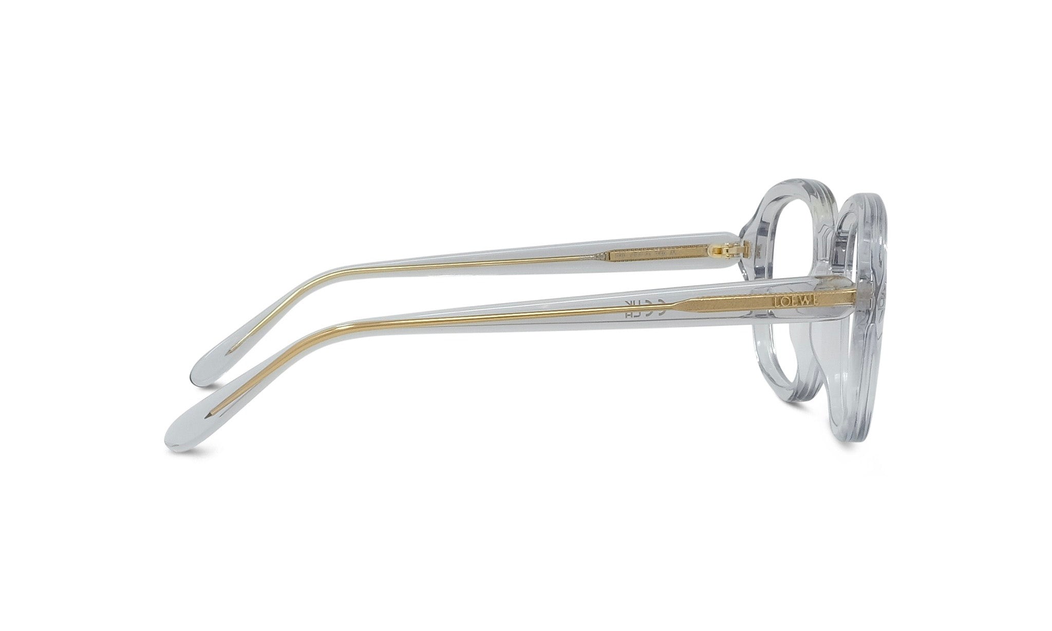 A pair of clear eyeglasses with gold accents, positioned side by side against a white background.