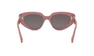 A pair of pink cat-eye sunglasses with dark lenses.