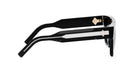 A pair of black and white sunglasses with a gold-colored frame.