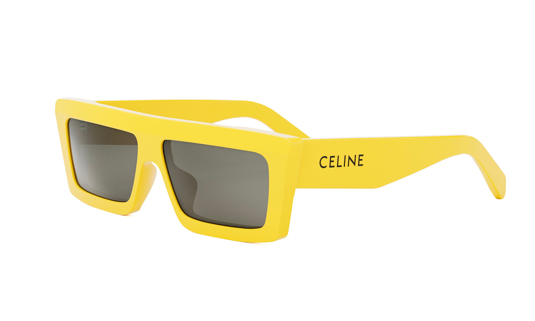 A pair of yellow sunglasses with the Celine logo on the frame.