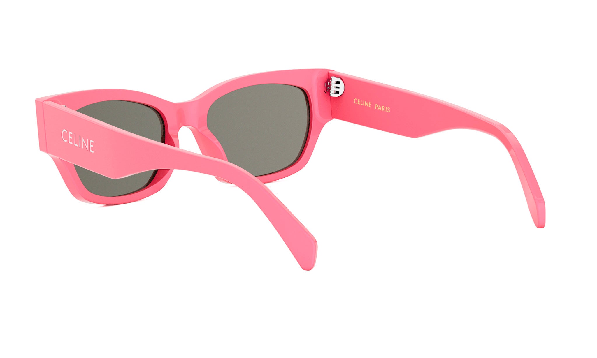 A pair of pink sunglasses with the Celine Paris logo on the frame.