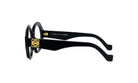 A pair of black-framed glasses with a gold logo on the frame.