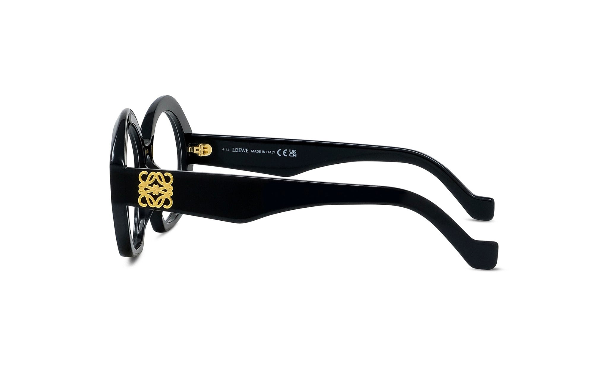 A pair of black-framed glasses with a gold logo on the frame.