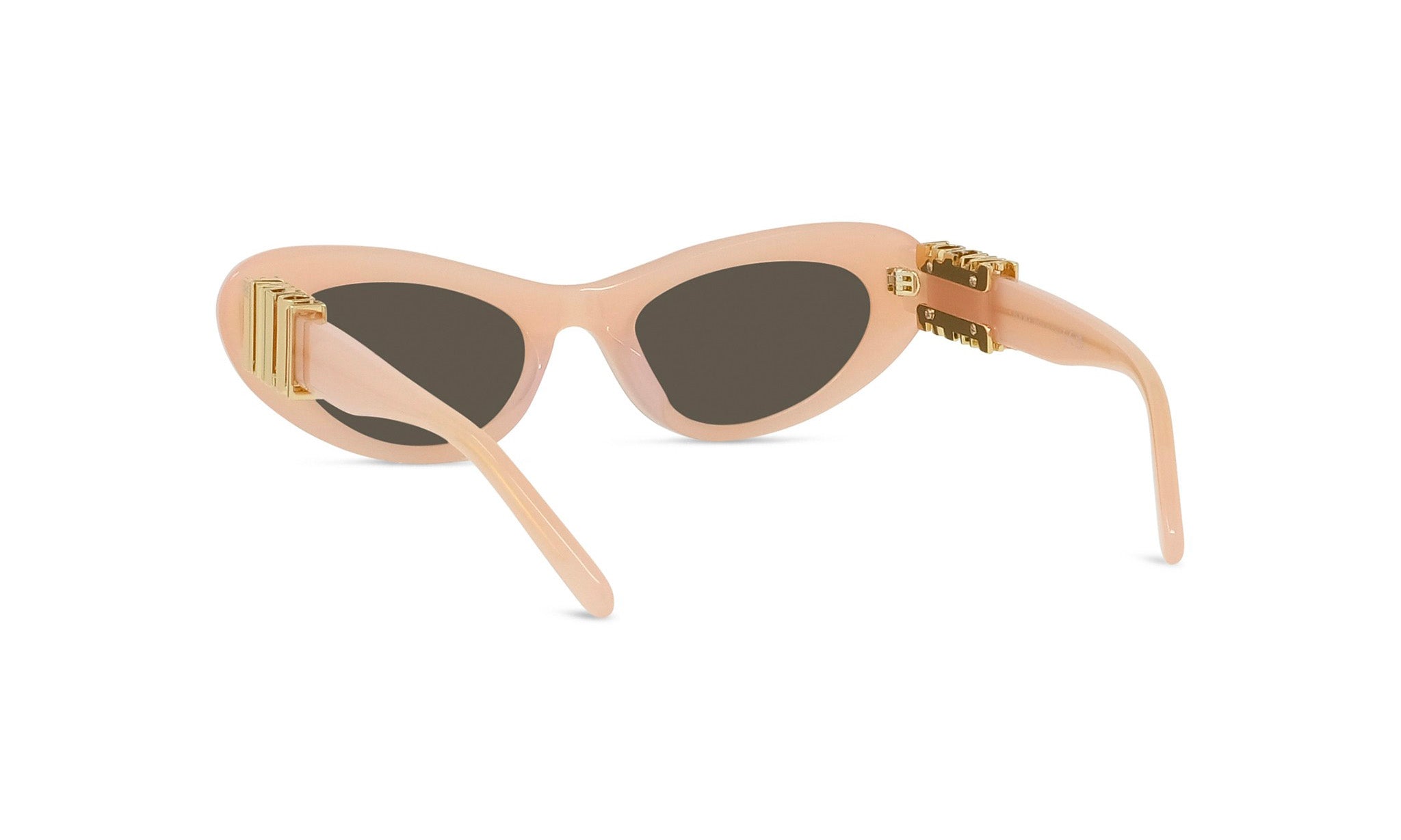 A pair of peach-colored sunglasses with gold-colored metal accents.