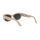 A pair of tan-colored sunglasses with a Dior logo on the frame.