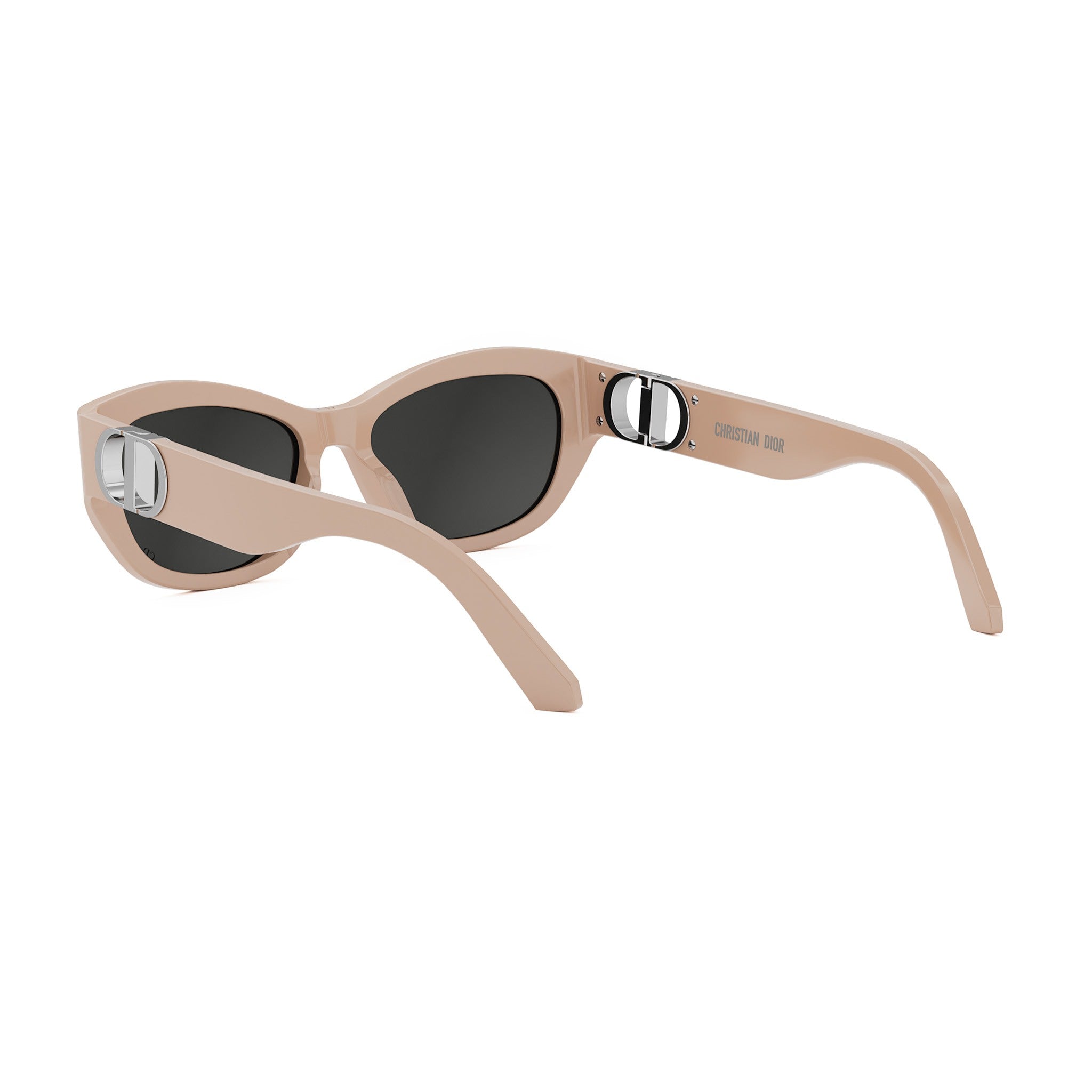 A pair of tan-colored sunglasses with a Dior logo on the frame.