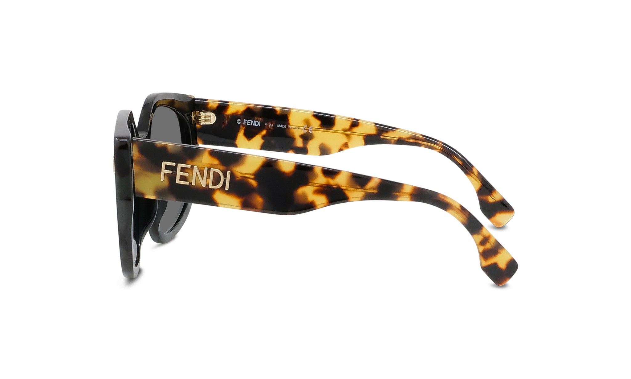 A pair of sunglasses with a tortoiseshell frame and the Fendi logo on the side.