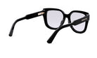 A pair of black-framed glasses with a gold-colored temple piece.