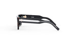 A pair of black and white sunglasses with the Dior logo visible on the frame.