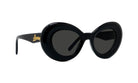 A pair of black, round sunglasses with gold lettering on the frame.
