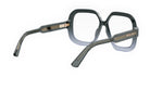 A pair of dark-colored, square-framed glasses with a gold-colored metal accent.