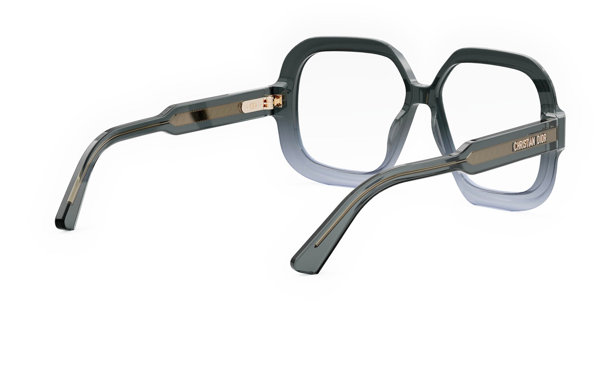A pair of dark-colored, square-framed glasses with a gold-colored metal accent.